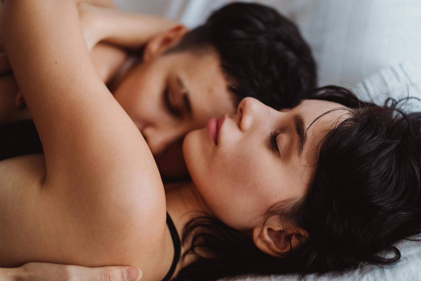 A tender embrace between a loving couple, showcasing intimacy and affection indoors.