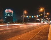 Vibrant night scene showing light trails on a street in Podgorica, Montenegro.
