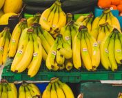 A vibrant display of fresh bananas at a local market stand, perfect for healthy eating.
