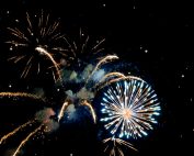 Vibrant fireworks illuminate the night sky, celebrating a festive event with bright and vivid explosions.