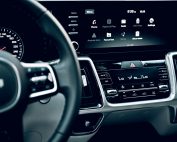 Close-up view of a luxury car's dashboard featuring a modern touchscreen display and advanced features.