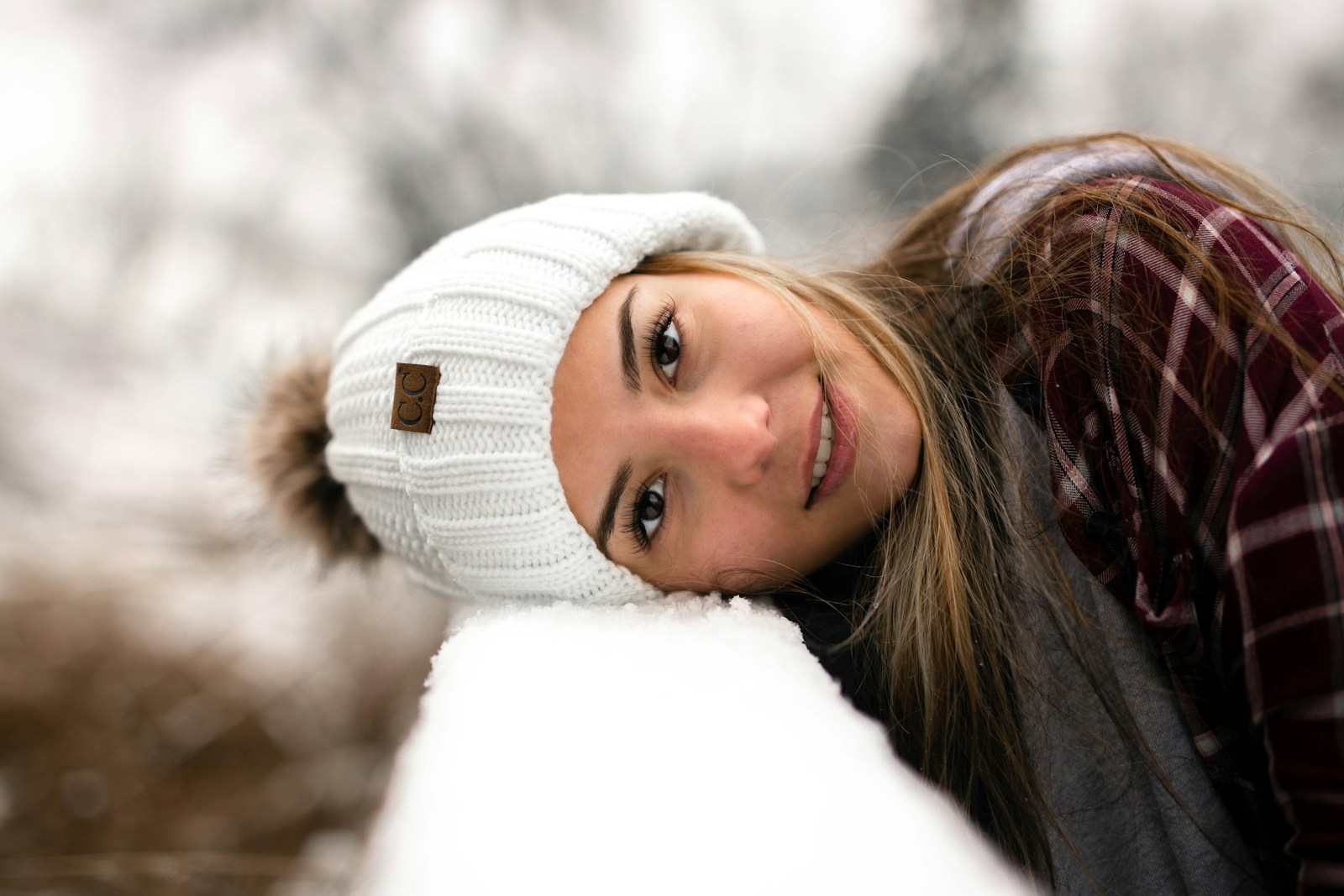 woman in white knit cap
