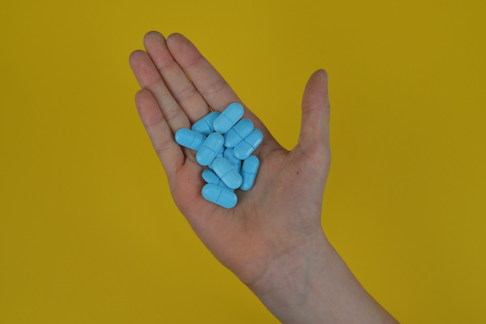 a hand with blue nails