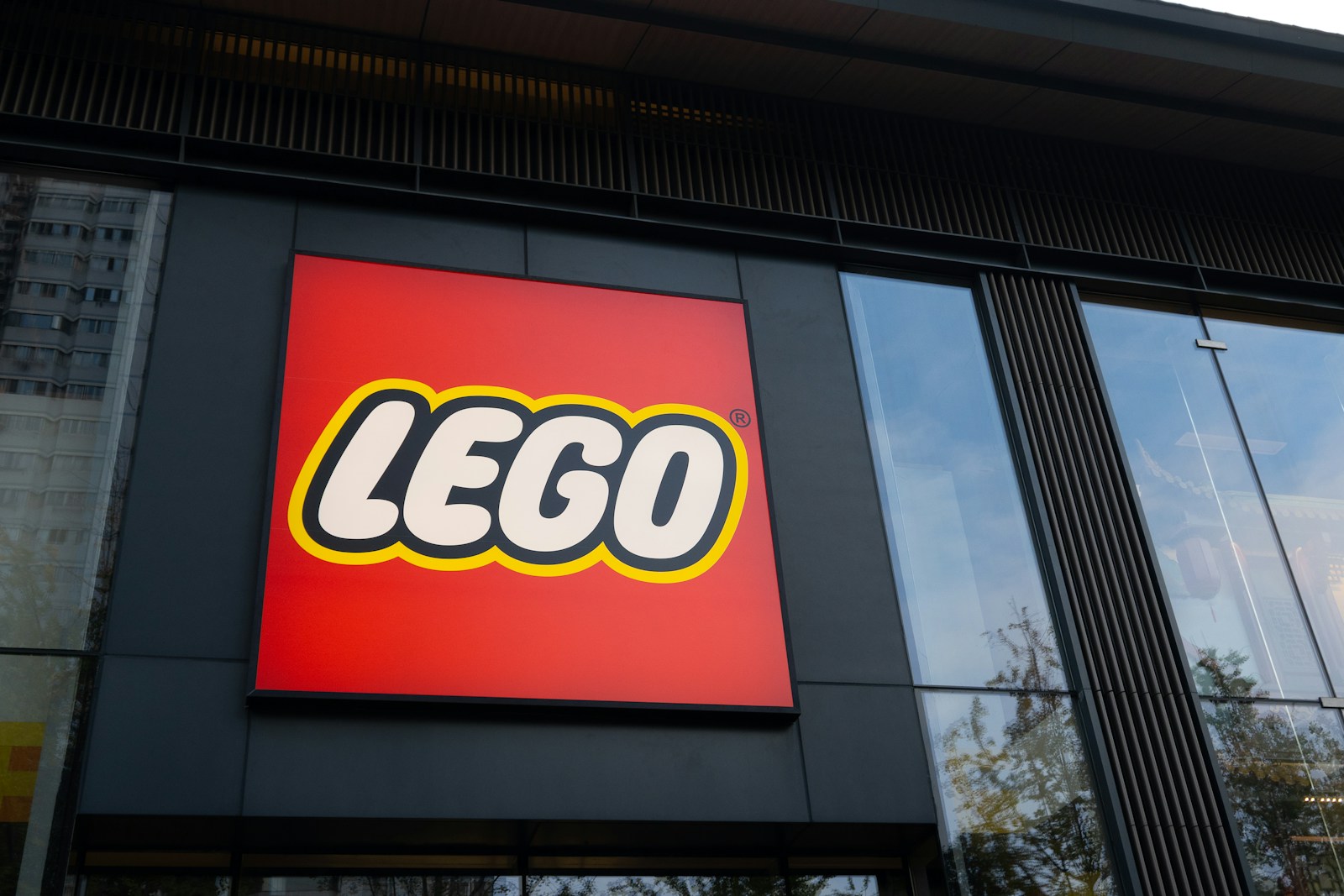 The lego store logo on a building facade.