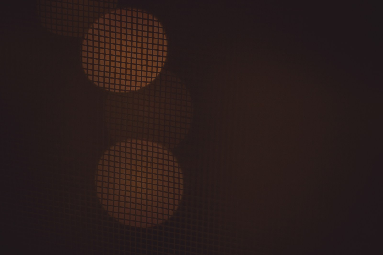 a close up of a traffic light in the dark