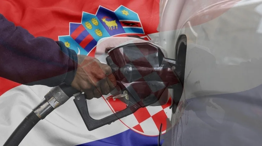 Ruka sa pištoljem za gorivo, sa nacijom Hrvatske zastave koja je složena preko slike.