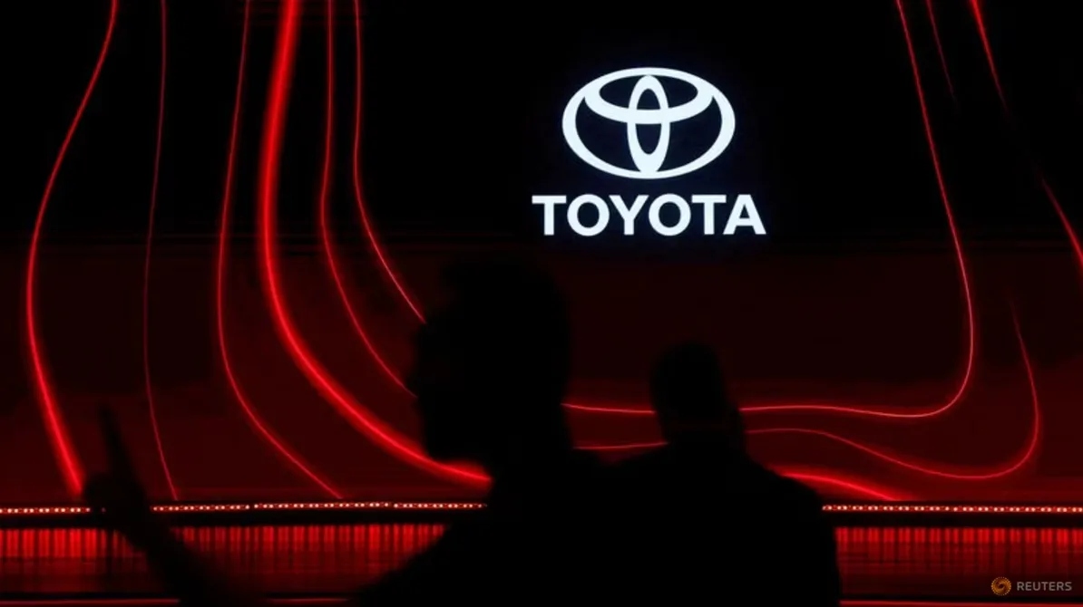 Toyota logo displayed on a screen with red glowing lines in the background.