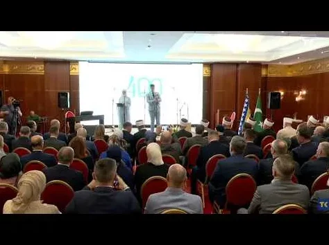 Public Audience at an Award Ceremony with Speakers on Stage