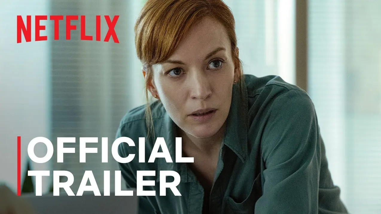 Žena crvenkaste kose gleda u stranu, nosi zelenu košulju, natpis Netflix i "OFFICIAL TRAILER" su vidljivi.