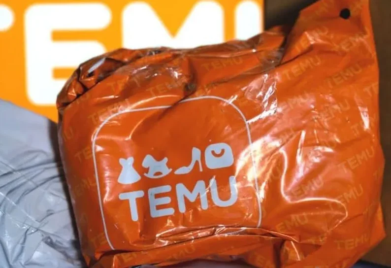 Narandžasta Temu kesa sa logom brenda.