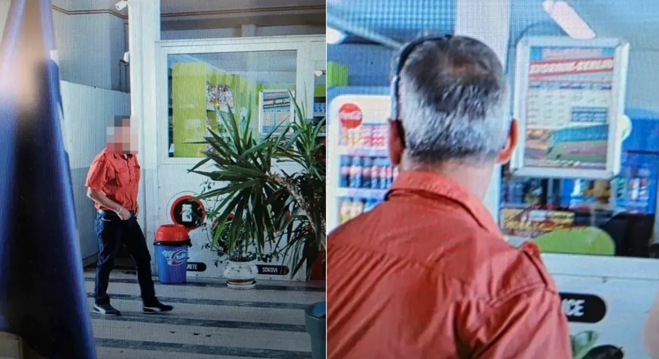 Čovjek u narandžastoj košulji gleda u frižider sa pićima u prodavnici