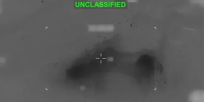 Snimak termovizije sa natpisom 'UNCLASSIFIED' zelenim slovima i nišanom u centru.